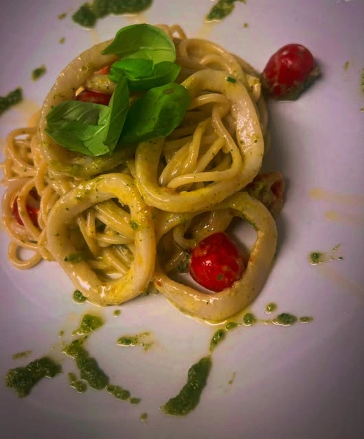 Pasta with basil and cherry tomatoes at Italio